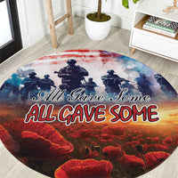 Round red, blue and orange Veterans Day carpet with soldier silhouettes and “All Gave Some” text