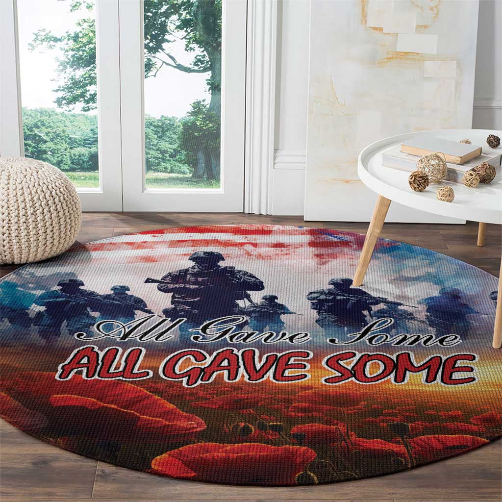 Round poppy Veterans Day carpet with blue soldier silhouettes and red “ALL GAVE SOME” text