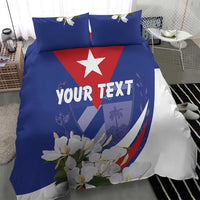 Blue and white bedding with red center star, 'YOUR TEXT' text, and floral design