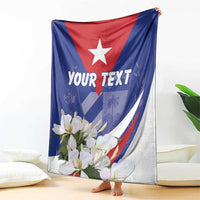 Blue and white star blanket with floral design and 'YOUR TEXT', draped on couch.