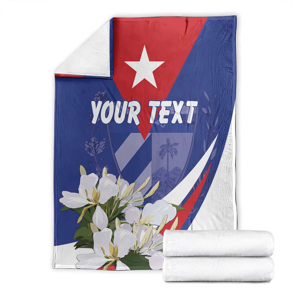 Folded blue and white personalized blanket with white star, flowers, and 'YOUR TEXT'.