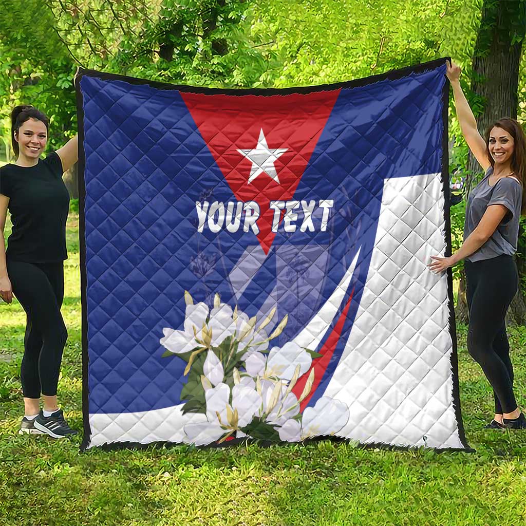 Personalized Cuba quilt blanket with Cuban star, “YOUR TEXT” and floral accents, held outdoors