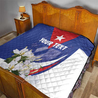 Personalized quilt blanket on bed, blue red and white Cuban flag star, “YOUR TEXT”, floral print
