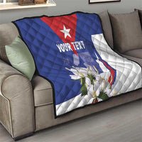 Personalized quilt blanket on couch, blue and white Cuban flag pattern with red star and “YOUR TEXT”
