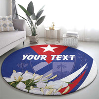 Personalized round rug showing blue Cuban flag, red star, floral border, and custom text