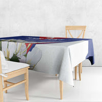 Blue and white tablecloth with printed floral border and corner drape