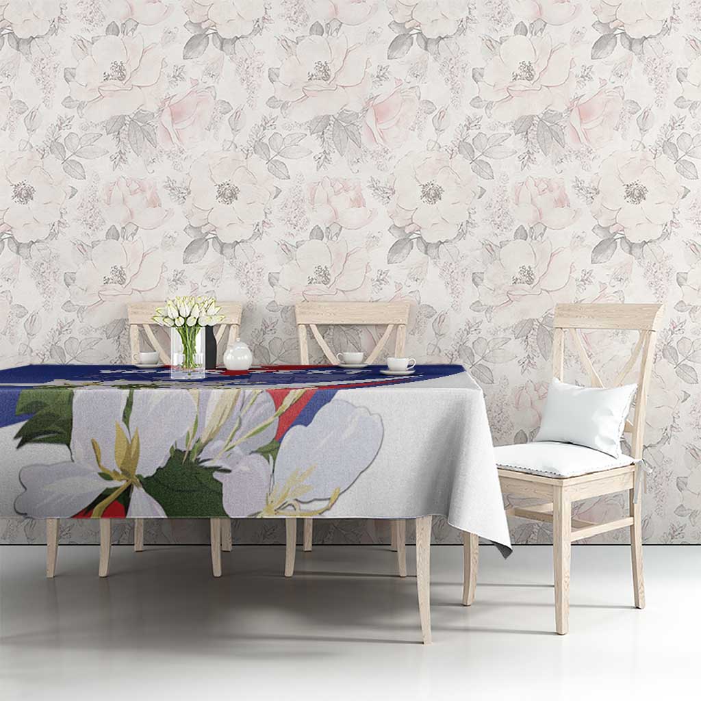 Blue patterned tablecloth with floral artwork and rectangular table coverage