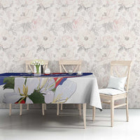 Blue patterned tablecloth with floral artwork and rectangular table coverage