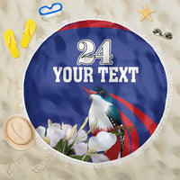 Blue round beach blanket with white fringe, centered '24 YOUR TEXT' and bird illustration