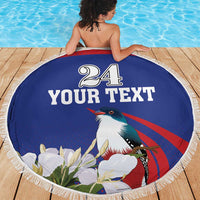 Blue round beach blanket with white fringe, bird graphic, and '24 YOUR TEXT' print