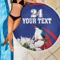 Blue round beach blanket with white fringe, '24 YOUR TEXT' text and bird with flowers