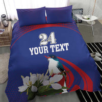 Blue duvet and two pillowcases featuring bird, white flowers, and “24 YOUR TEXT”