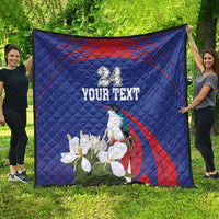 Blue quilt blanket with custom text, bird and white flowers, red curved stripe detail