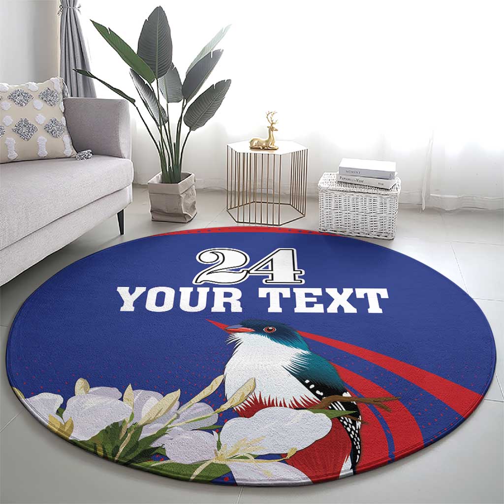 Round blue circular rug featuring "24 YOUR TEXT" and a toucan with leafy white flowers