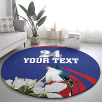 Round blue circular rug featuring "24 YOUR TEXT" and a toucan with leafy white flowers