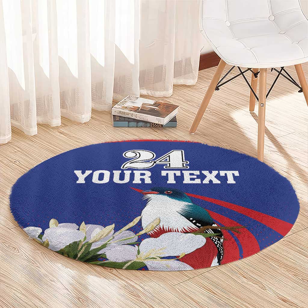 Round blue circular rug with "24 YOUR TEXT" toucan, red stripe, and white blossoms