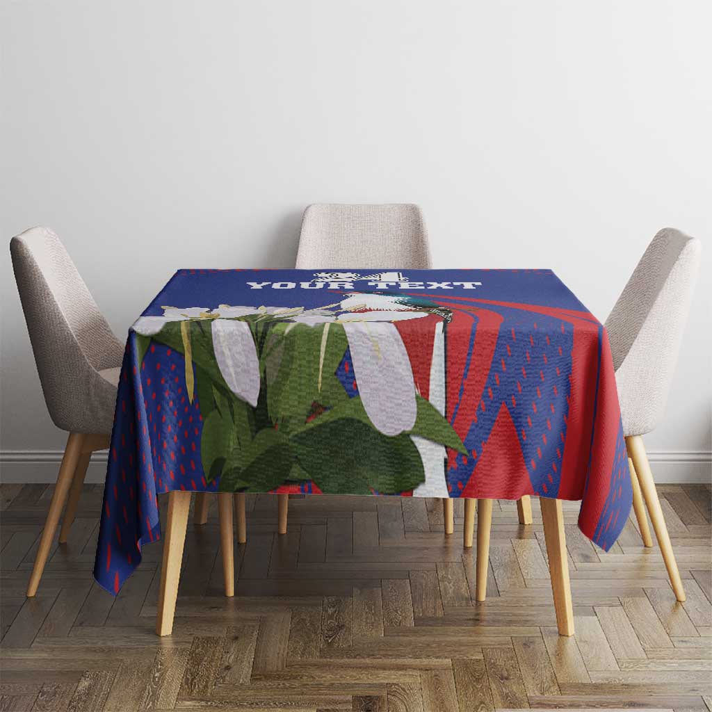 Blue tablecloth with red pattern and white bird, square table setup with four chairs
