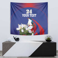 Blue and red tapestry with “Your Text”, number 24, parrot perched on white flowers.