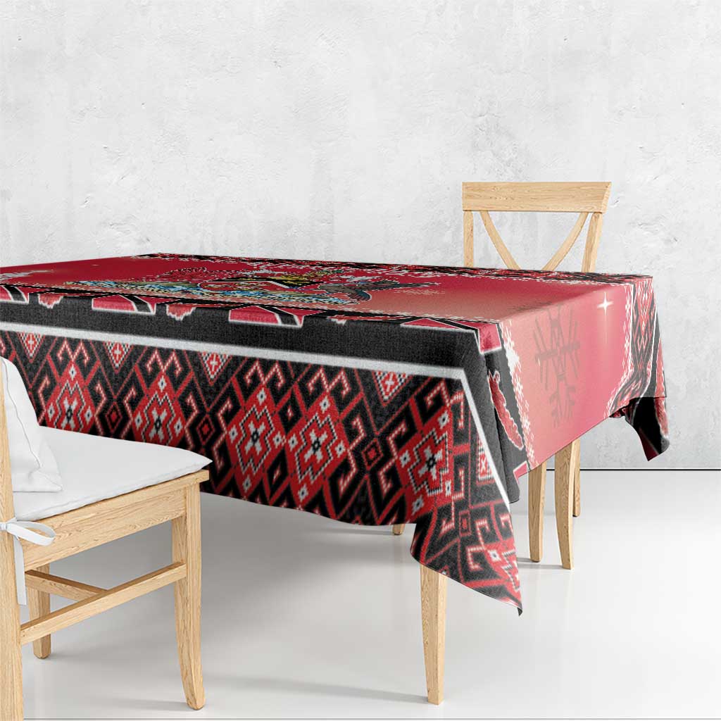 Red, black, and white tablecloth with geometric print and corner drop