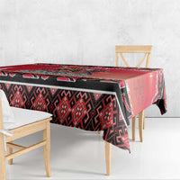 Red, black, and white tablecloth with geometric print and corner drop