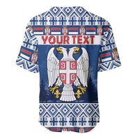 Blue Christmas baseball jersey with Serbia crest and wings, with 'YOUR TEXT' across chest.
