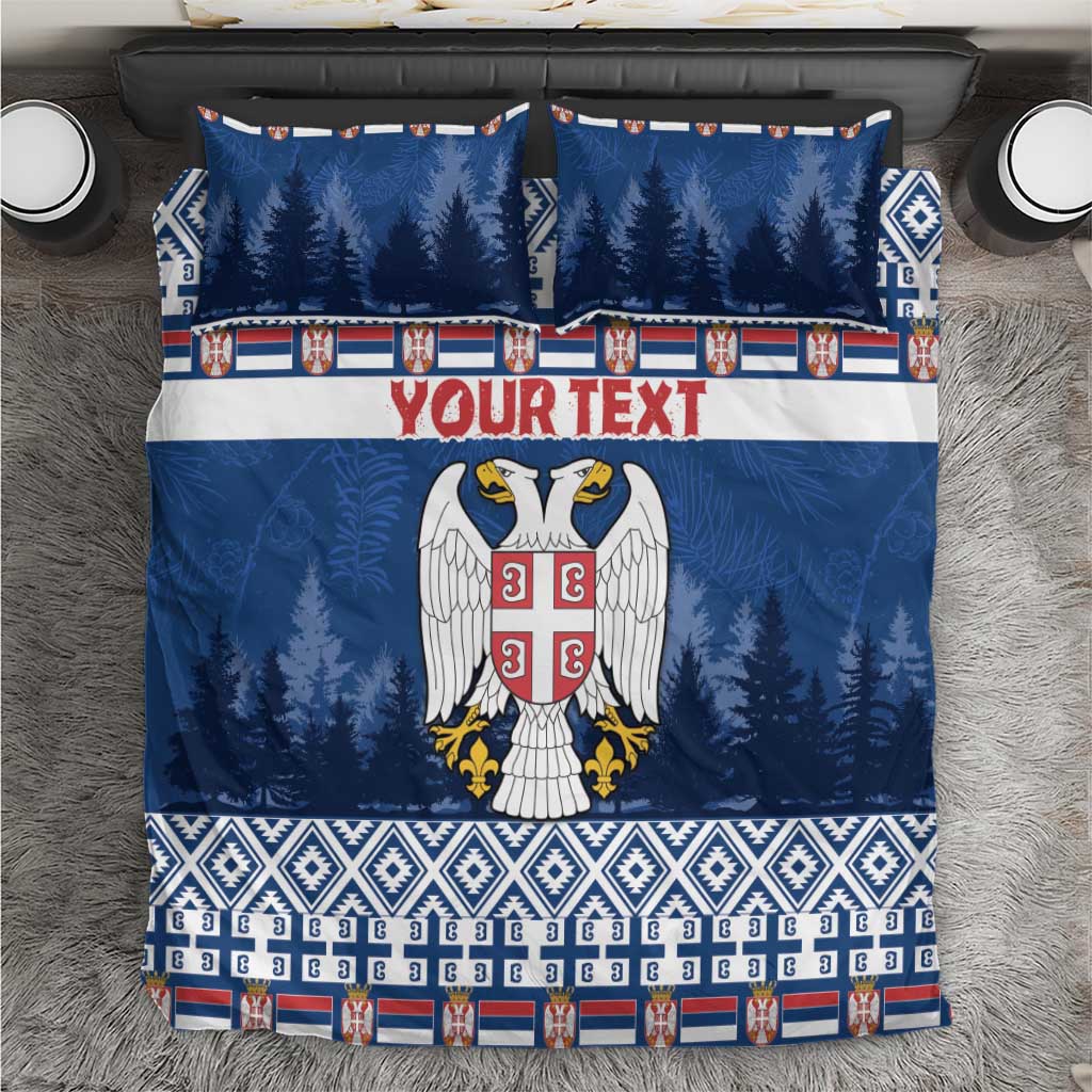 Blue Christmas bedding set with pine tree print, eagle crest, and patterned border