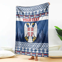 Blue blanket with eagle coat of arms, red "YOUR TEXT", and patterned border stripes
