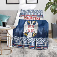 Blue personalized blanket with eagle coat of arms, "YOUR TEXT", and striped bottom edge