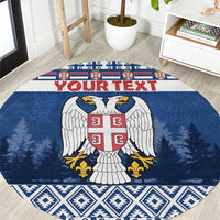 Blue round coat of arms Christmas area rug, pine tree and geometric border pattern