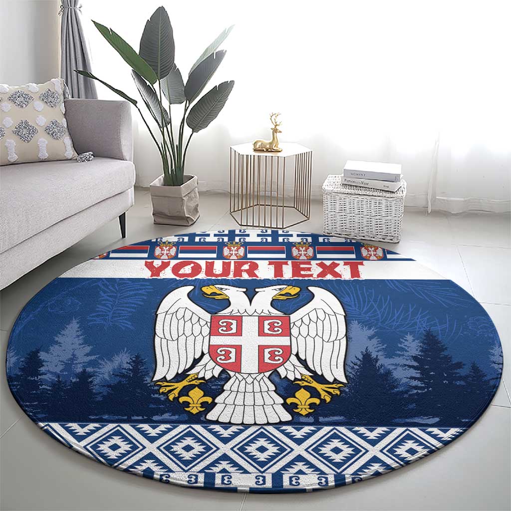 Blue round coat of arms rug with red crest, pine trees, and diamond trim