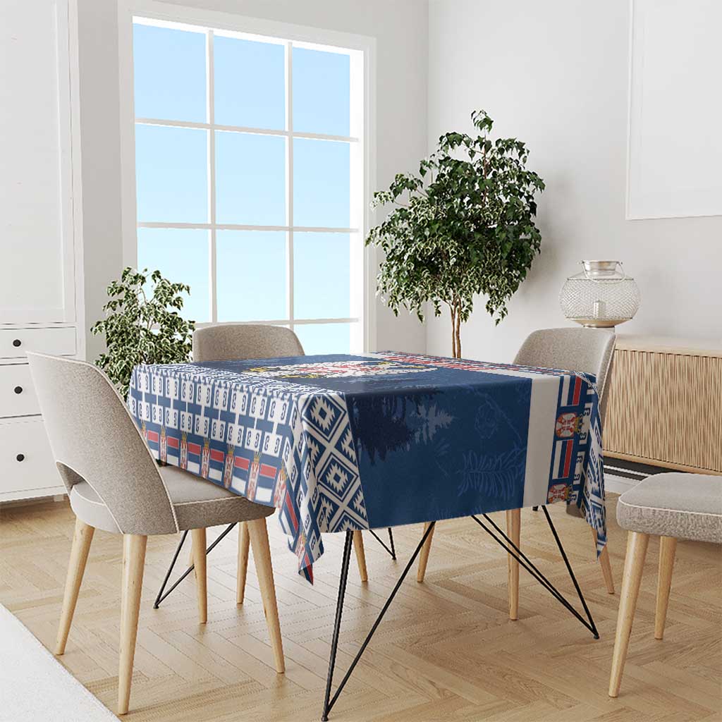 Blue Serbia coat of arms tablecloth with geometric border design across the table.