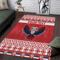 Red area rug with double-headed eagle, geometric border, and "YOUR TEXT" band