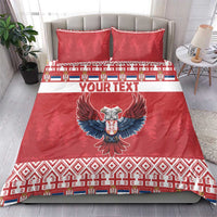 Red duvet bedding set with eagle emblem, “YOUR TEXT” band, and festive pattern; two matching pillows