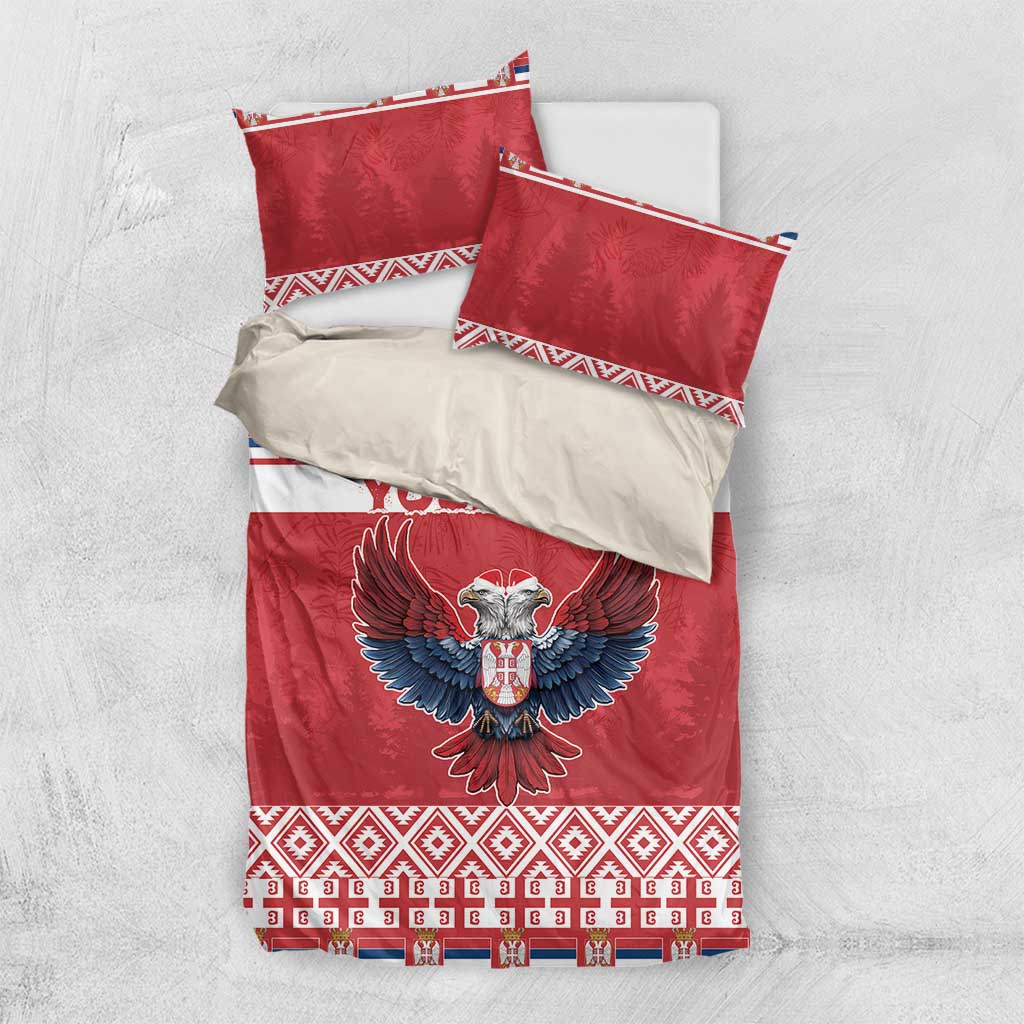 Red bedding set shown flat: duvet and two pillowcases with eagle emblem and festive stripes