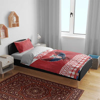 Red personalized bedding on bed: eagle emblem, “YOUR TEXT” band, and patterned edge trim