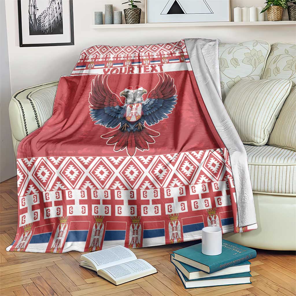 Red personalized Christmas blanket with double-headed eagle and pattern border, folded view
