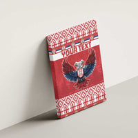 Red canvas wall art on wall with double-headed eagle emblem and “YOUR TEXT”
