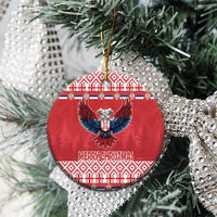 Red round ceramic Christmas ornament with double-headed eagle and Merry Christmas text