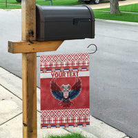 Red flag on wooden post with double-headed eagle art and 'YOUR TEXT' banner strip