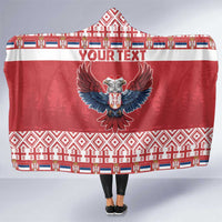 Red hooded blanket with eagle emblem and Serbian-style pattern border, wrap front