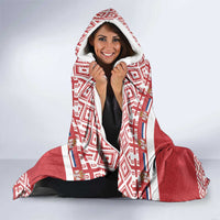 Red and white hooded blanket with patterned hood and eagle center graphic, wearable