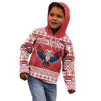 Kids red hoodie with hood, eagle graphic, and festive patterned sleeves, worn on a child.
