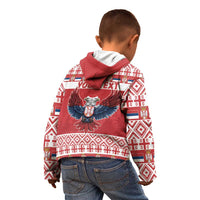 Kids red hoodie back view with hood, eagle emblem, and holiday pattern panel.