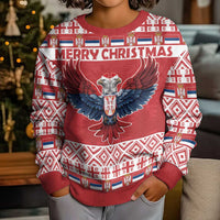 Kids red Christmas sweater with "MERRY CHRISTMAS" eagle center and geometric border
