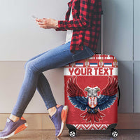 Red suitcase cover with double-headed eagle crest and 'YOUR TEXT' design on four wheels