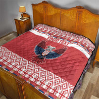 Red and white quilt on bed with 'YOUR TEXT' and double-headed eagle emblem, quilted top