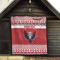 Red quilt hanging on barn wall, 'YOUR TEXT' and double-headed eagle, patterned edges