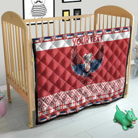 Red quilt on baby crib with double-headed eagle and 'YOUR TEXT', quilted white band