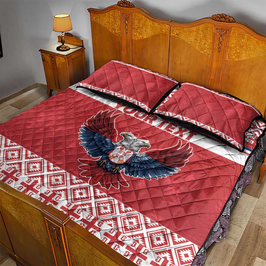 Red quilt bed set with eagle artwork and striped band across quilt top