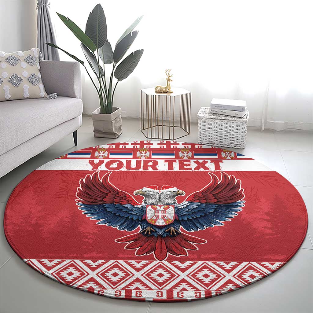 Red round carpet rug with central double-headed eagle, blue wings, and red/white border
